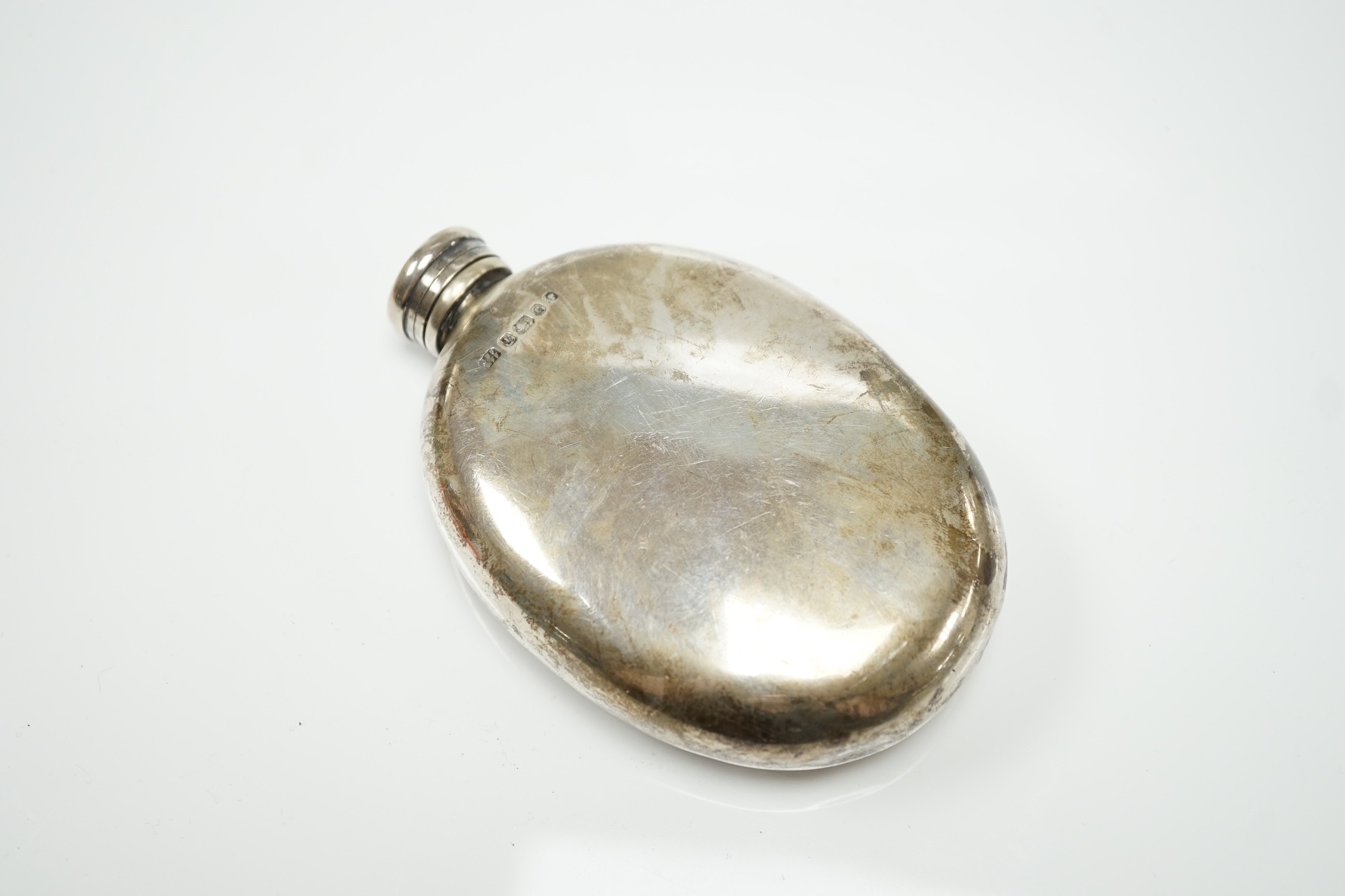 A Victorian silver oval hip flask, Fenton Brothers, Sheffield, 1874, 12.5cm, 6.3oz.